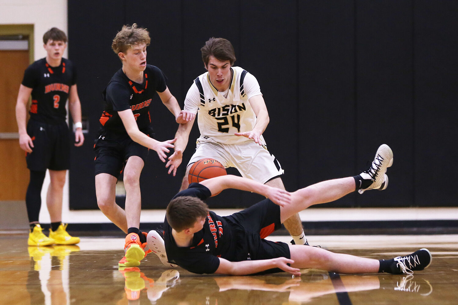 Colby Bessler jumps in an attempt to recover a fumbled Burns ball